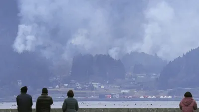 Japan is witnessing a wildfire that has damaged dozens of homes and forced hundreds of residents to evacuate in a northeastern coastal city.