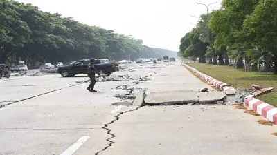An earthquake of magnitude 7.7 struck central Myanmar on Friday, sending tremors till Thailand, China, Vietnam and India as well. This image shows a soldier providing security while vehicles make their ways near a damaged road caused by an earthquake. An earthquake of magnitude 7.7 struck central Myanmar on Friday, sending tremors till Thailand, China, Vietnam and India as well. This image shows a soldier providing security while vehicles make their ways near a damaged road caused by an earthquake.