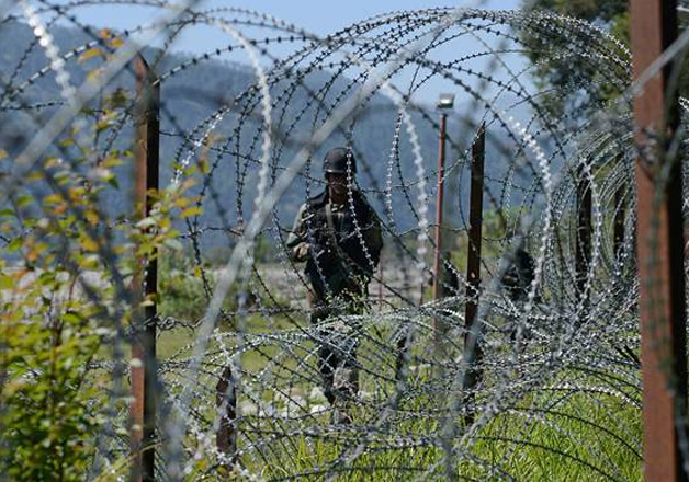 A file photo of an Indian Army soldier patroling along the