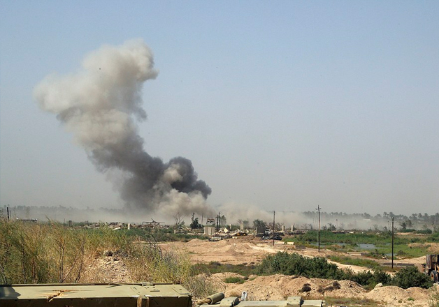 Smoke rises from ISIS positions after an airstrike by