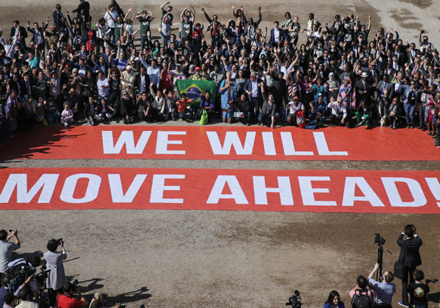 COP22 participants stage a public show of support for Paris