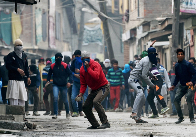 Youths pelting stones at security forces in Srinagar