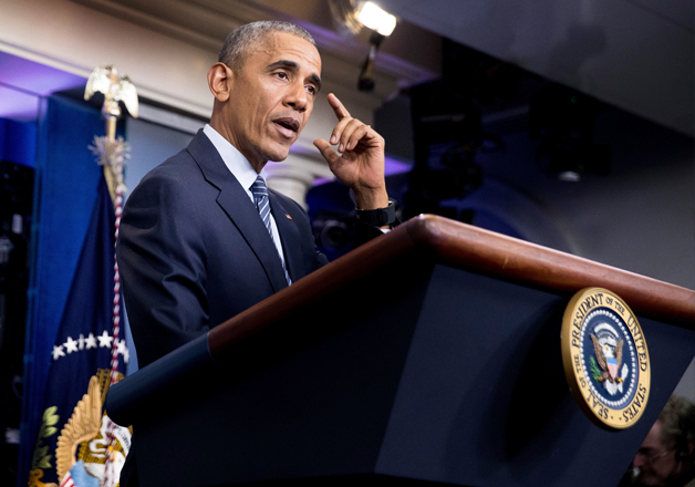Barack Obama speaks during a news conference at the White