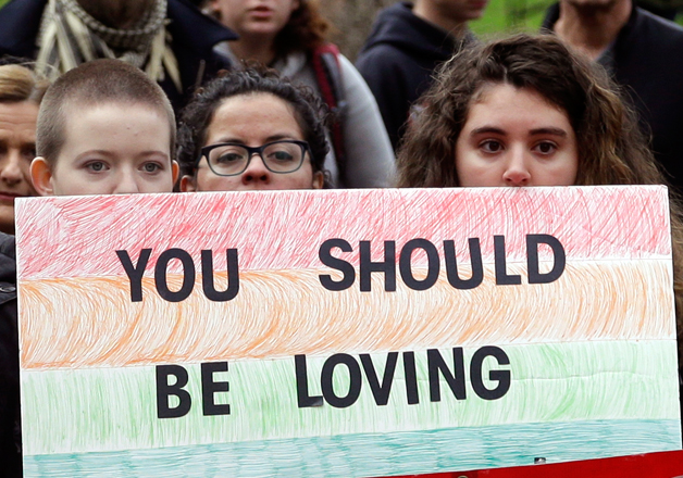 Protesters gather before marching through the streets in