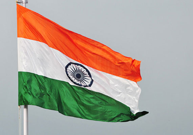 Need not stand for National Anthem when it is part of film: