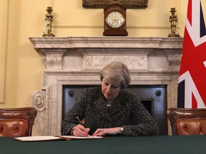 Theresa May signs the letter triggering Article 50 in