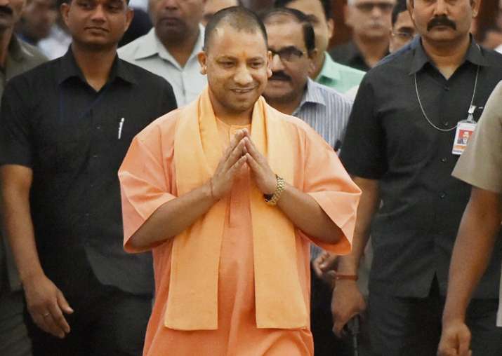CM Aditiyanath walks to attend the UP Assembly session in