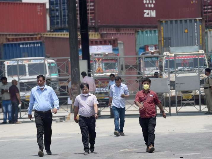 NDRF members during the clean-up operation at a container