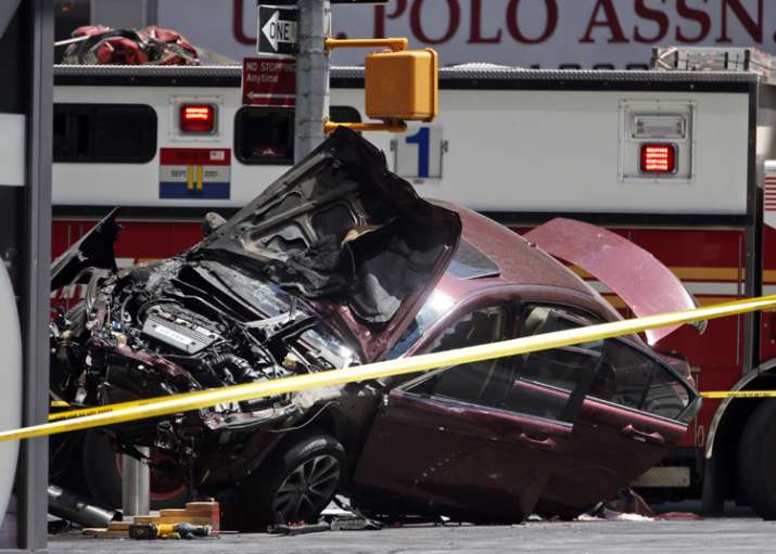 One killed as car drives into crowd in New York’s Times