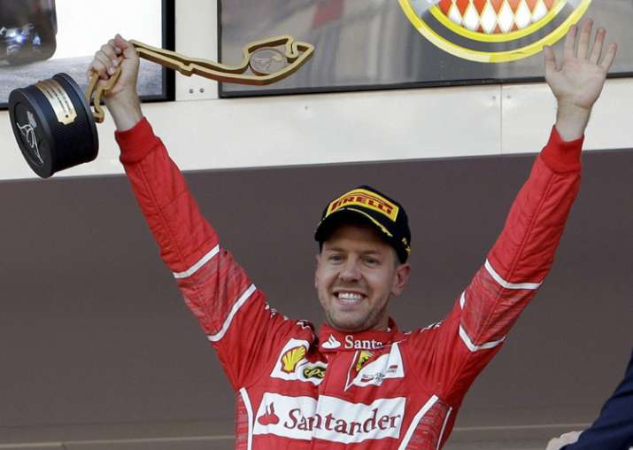 Sebastian Vettel celebrates after winning the Formula One