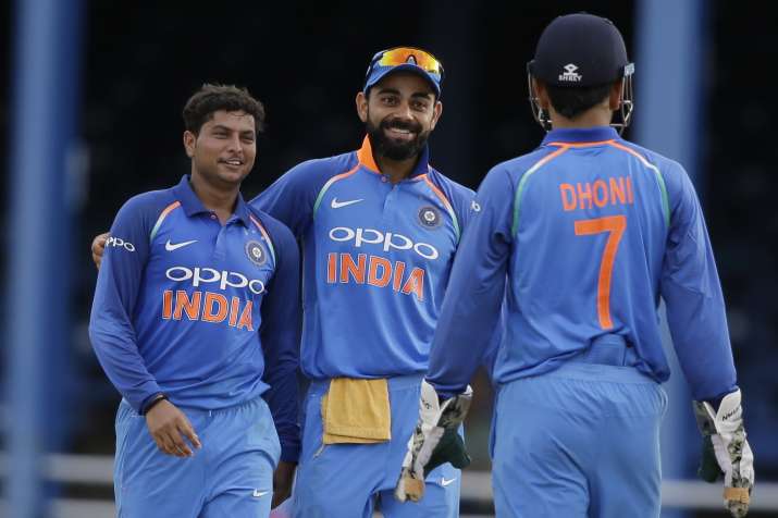 Kuldeep Yadav celebrates fall of wicket with skipper Virat