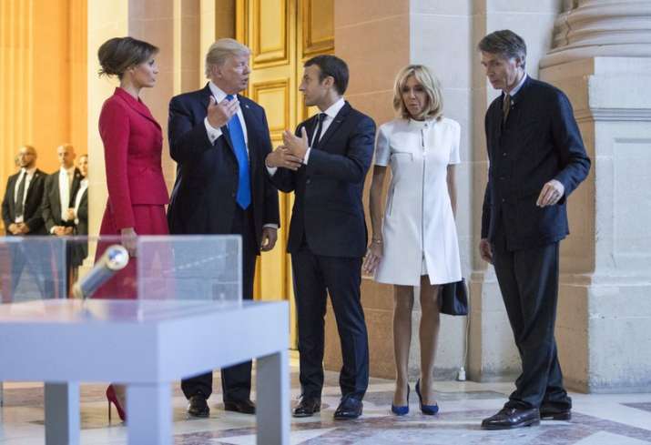 Trump, Macron and their wives chatting after their tour to