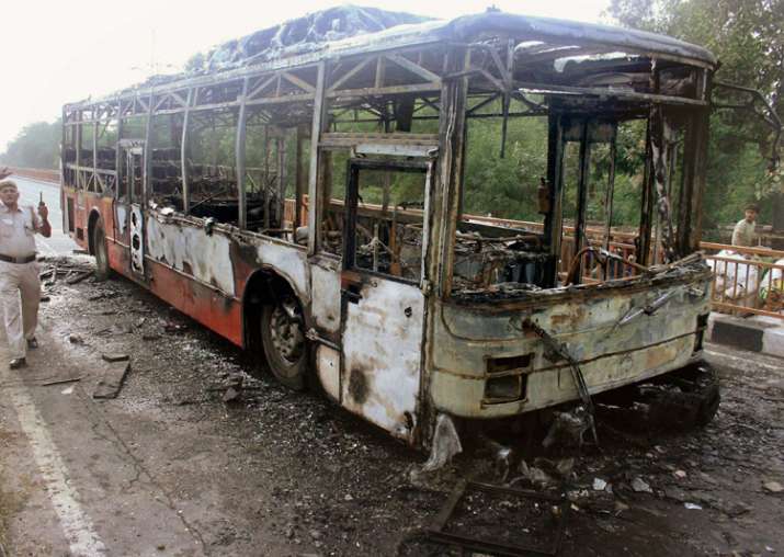New Delhi: A DTC bus set on fire by followers Gurmeet Ram