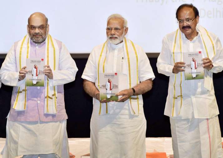 Amit Shah, PM Modi and Venkaiah Naidu at an event in New