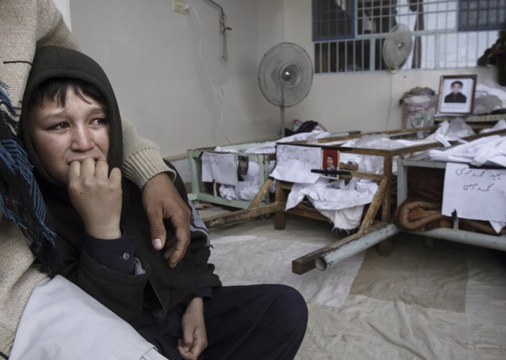 File - A Pak boy, whose brother was killed in bombing,