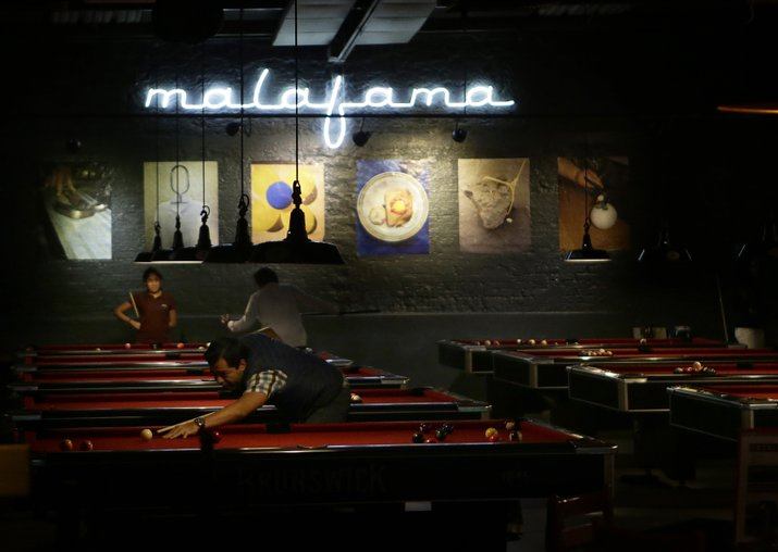 Locals play pool at a venue in Mexico City’s La Condesa