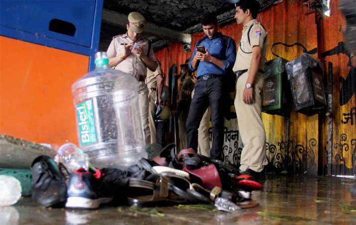 Policemen at the site of the stampede at Elphinstone Road