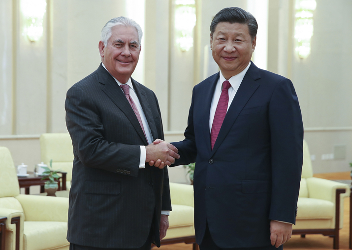 Rex Tillerson shakes hands with Xi Jinping at the Great