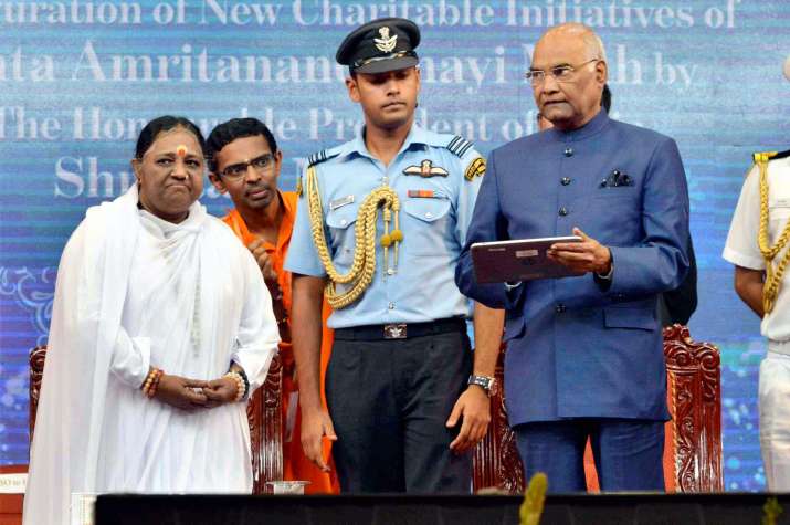 President Kovind refuses umbrella, takes salute amid