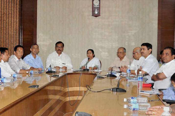 West Bengal Chief Minister Mamata Banerjee holding an all