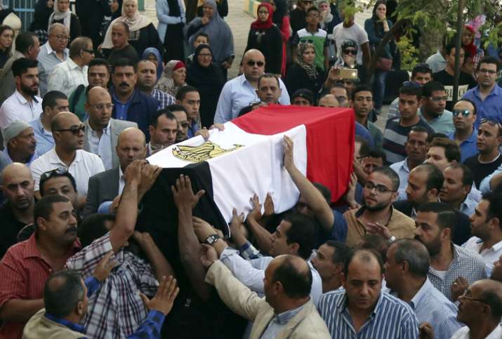 People carry the coffin of a policeman killed in an ambush