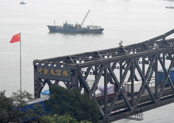 File pic - Trucks transport goods to North Korea through