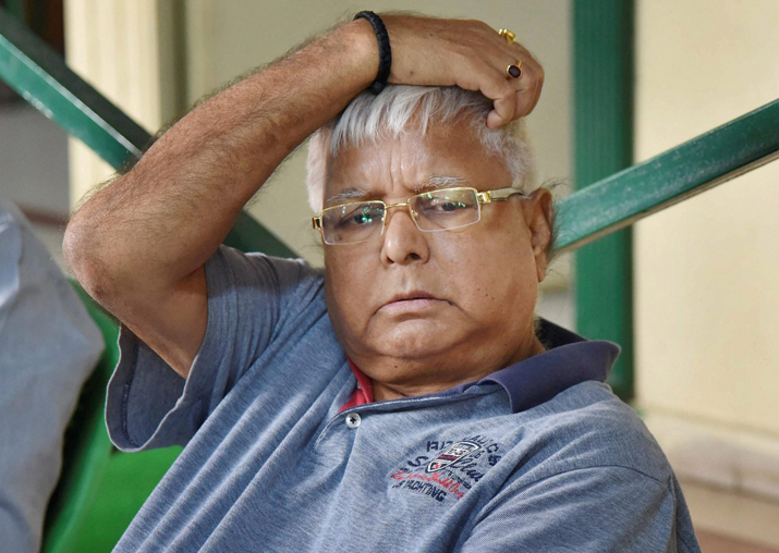 RJD Chief Lalu Prasad Yadav addressing a press conference