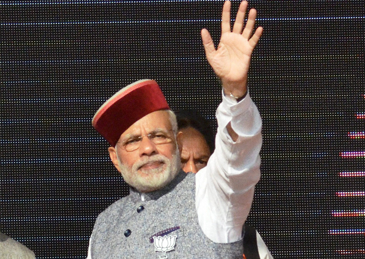 PM Narendra Modi waves at crowd during BJP Parivartan Rally