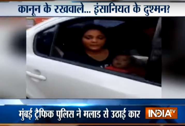 Mumbai traffic cop tow away car with woman breastfeeding