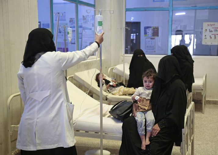 File pic - People are treated for suspected cholera