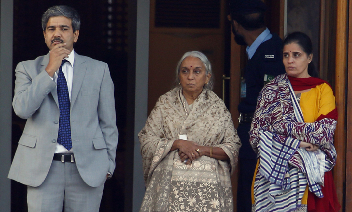The wife, right, and mother, center, of imprisoned Indian