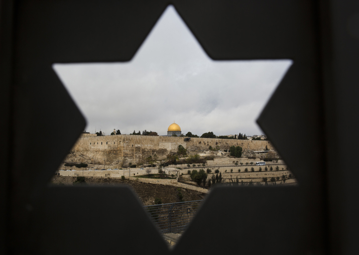 Jerusalem Old City is seen trough a door with the shape of