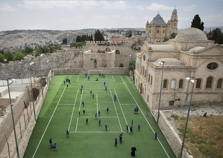 Armenian school kids play in the soccer field located next