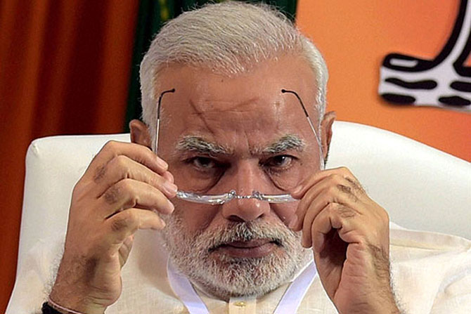 Riding ‘Modi wave’, BJP retains power in traditional