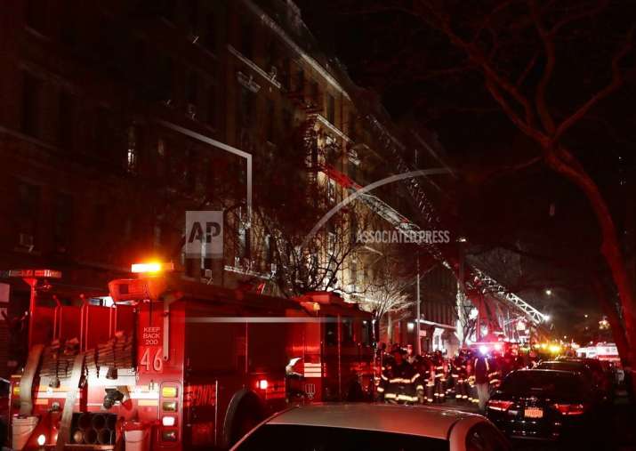 Firefighters respond to a building fire in the Bronx