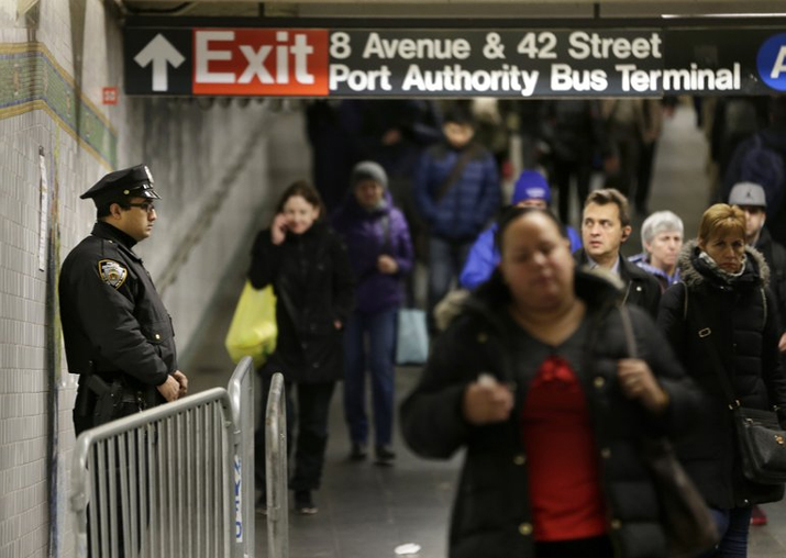 A police officer stands in the passageway connecting New