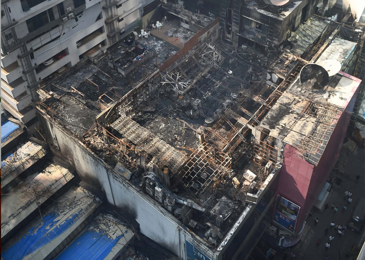 A view of the charred building in which a fire broke out in