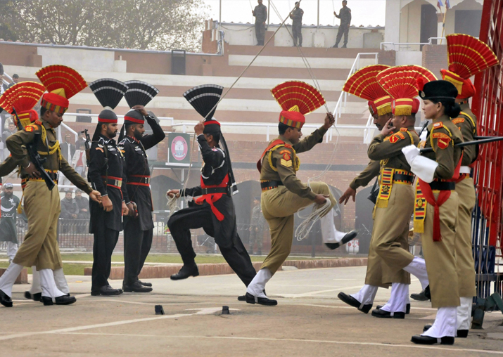 BSF and Pak Rangers lower their countries' flags during the