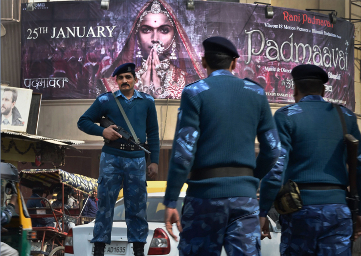 Security personnel guard outside a cinema house after