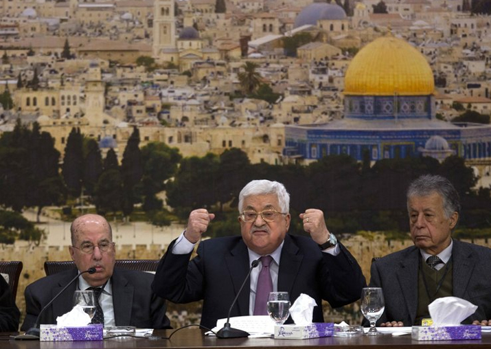 Palestinian President Mahmoud Abbas, center, speaks during