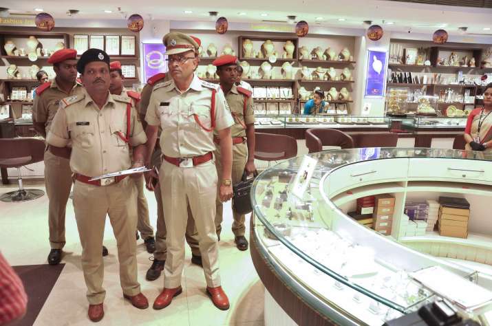 ED officials inspect a jewellery store during a raid in