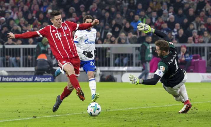 India Tv - Bayern Munich's Rober Lewandowski scores a goal.