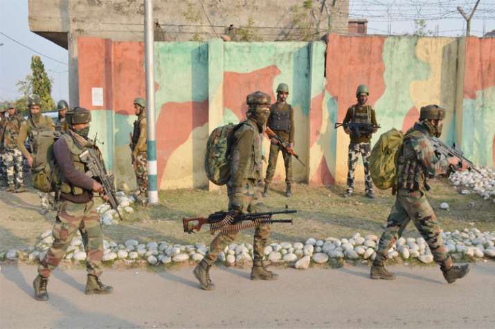 Security personnel take positions during a militants attack