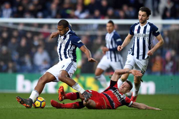 India Tv - Huddersfield's defeder tackles West Brom forwards