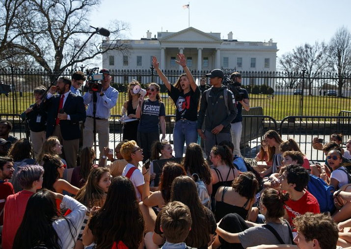 Demonstrators take part in a student protest for gun