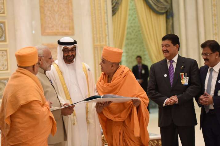 India Tv - Temple Committee members presenting the temple literature to the Crown Prince of Abu Dhabi and PM Modi.