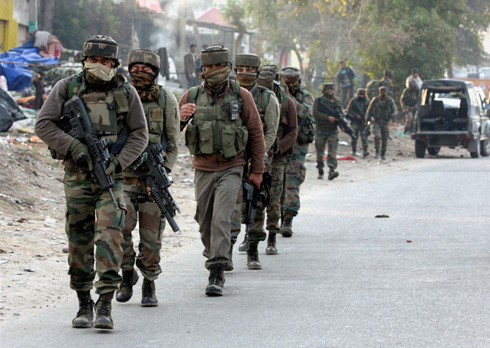 Security personnel take positions during a militants attack