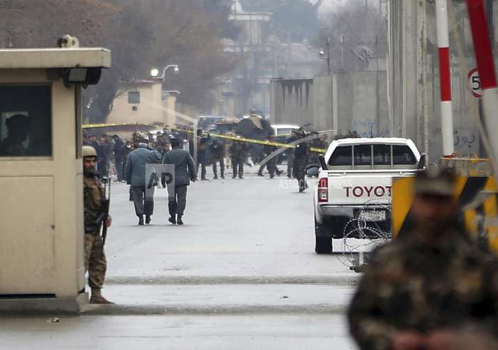 Security forces inspect the site of a suicide bombing in