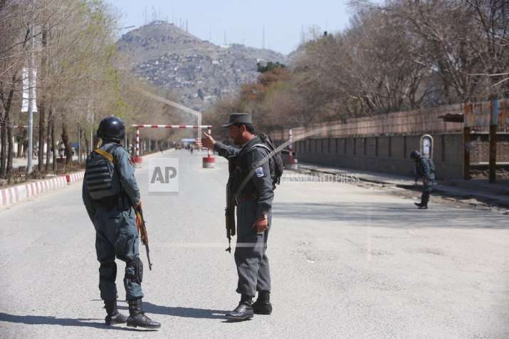 Police patrol the streets after a suicide attack in front
