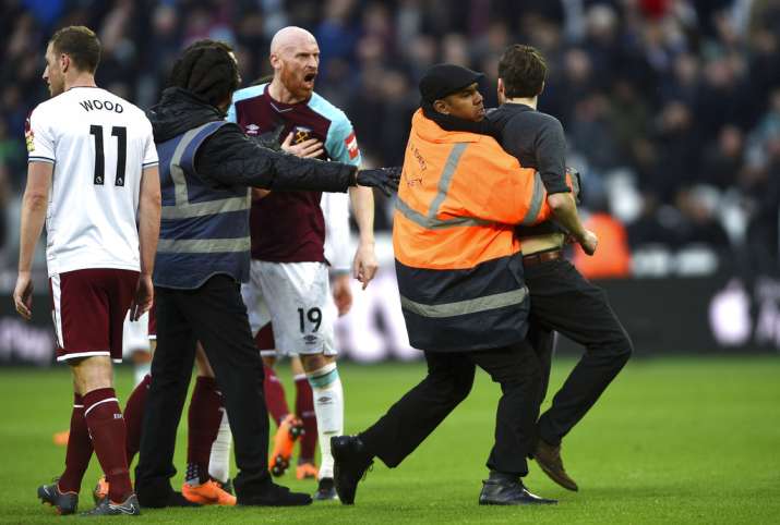 India Tv - West Ham fan confronts James Collins during the match